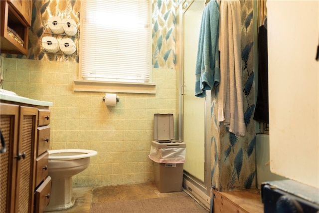 bathroom with brick wall, vanity, and toilet