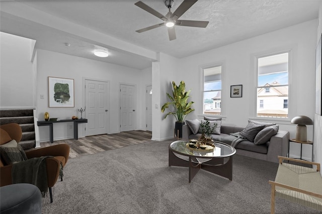 carpeted living room featuring ceiling fan