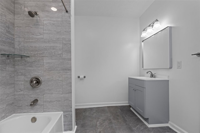 bathroom featuring tile flooring, vanity, and tiled shower / bath