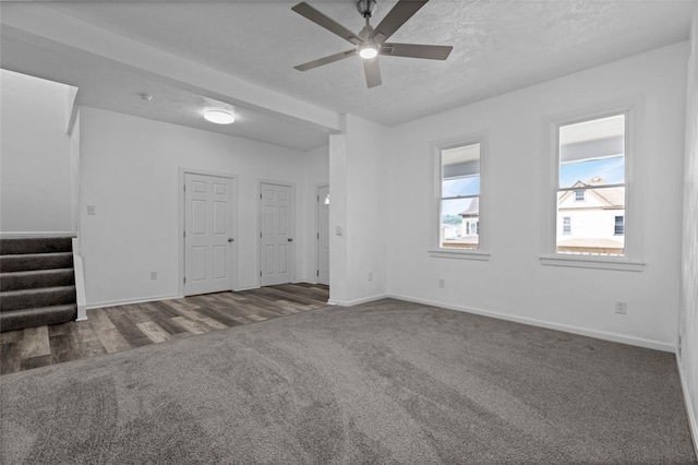 unfurnished room featuring ceiling fan and dark hardwood / wood-style flooring