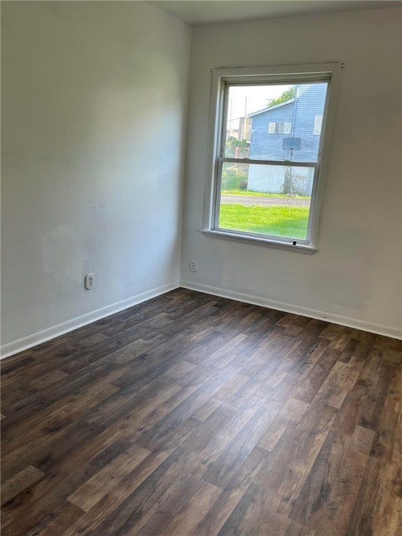 empty room featuring dark hardwood / wood-style flooring