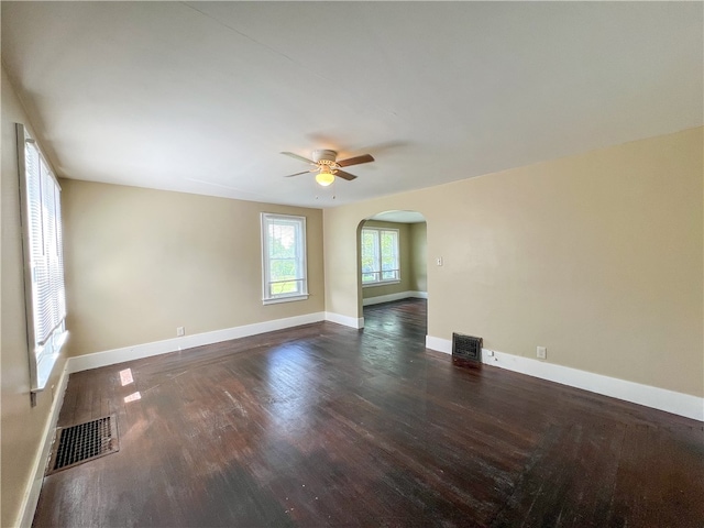 empty room featuring ceiling fan and hardwood / wood-style floors