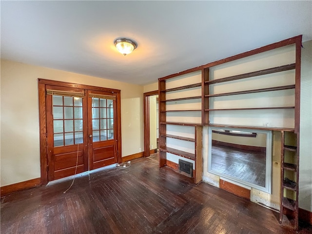 foyer with french doors and dark wood-type flooring