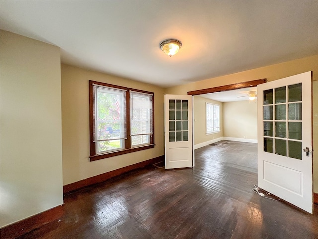 spare room with dark hardwood / wood-style floors