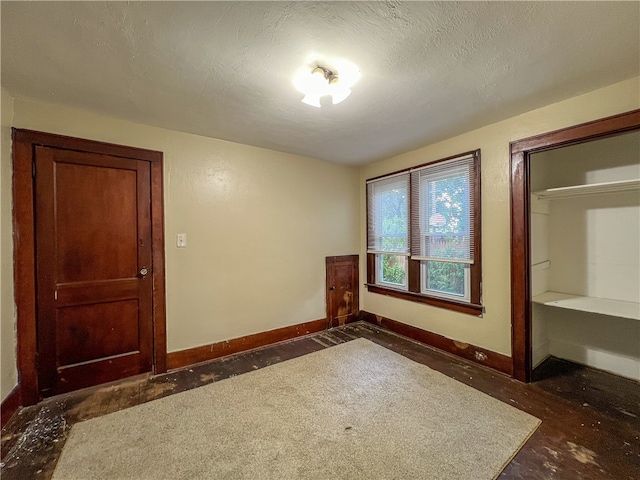 empty room with a textured ceiling