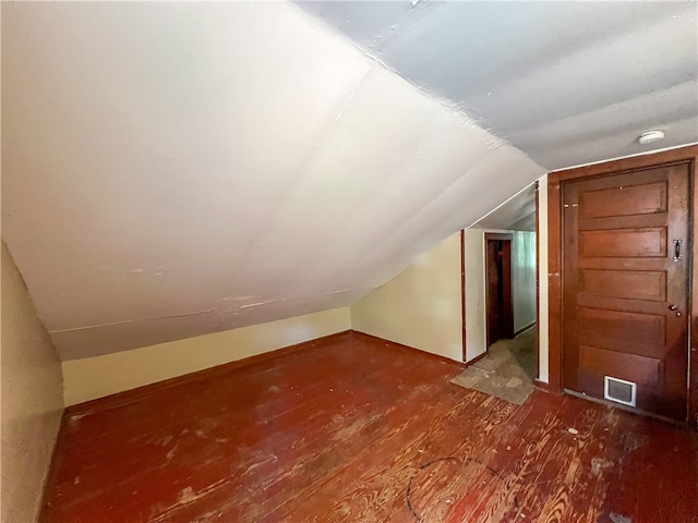 bonus room with vaulted ceiling and hardwood / wood-style floors