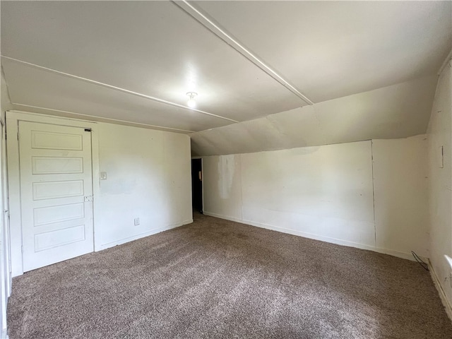 additional living space with carpet floors and lofted ceiling