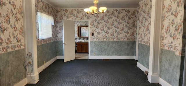 unfurnished dining area featuring a chandelier and dark colored carpet