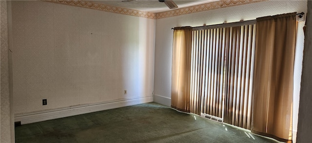 carpeted empty room with ceiling fan