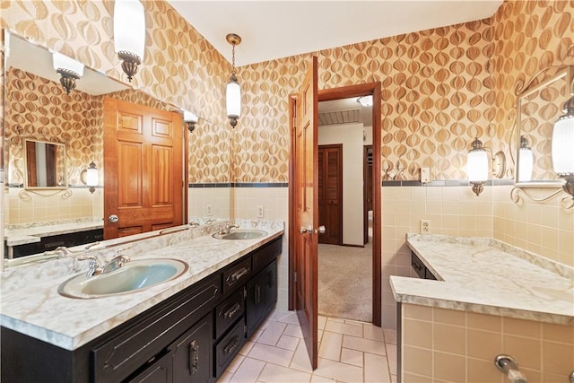 bathroom featuring tile patterned floors, vanity, and tile walls