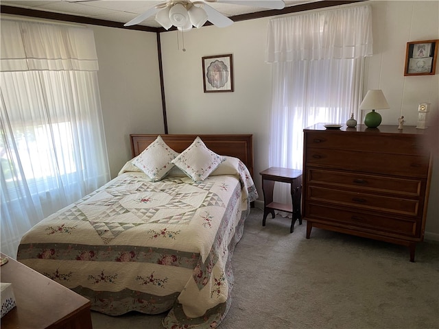 bedroom with ceiling fan and carpet floors