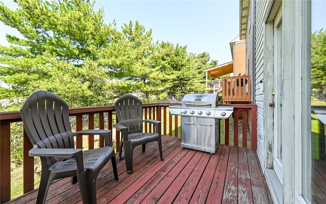 wooden terrace with area for grilling