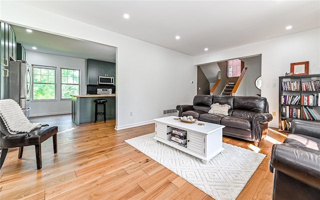 living room with light hardwood / wood-style flooring