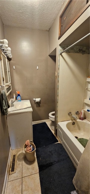 full bathroom featuring shower / washtub combination, toilet, tile flooring, vanity, and a textured ceiling