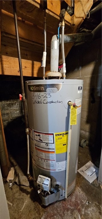 utility room featuring water heater