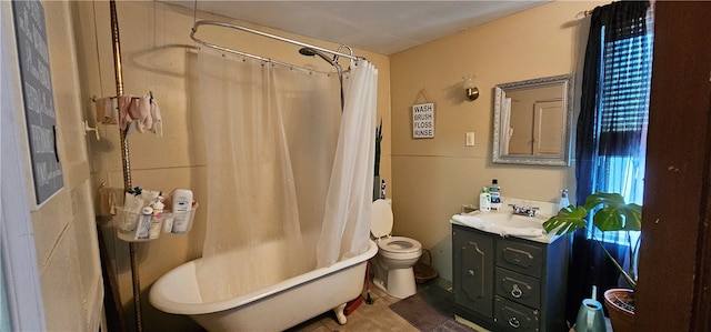 full bathroom featuring tile floors, shower / bath combination with curtain, vanity, and toilet