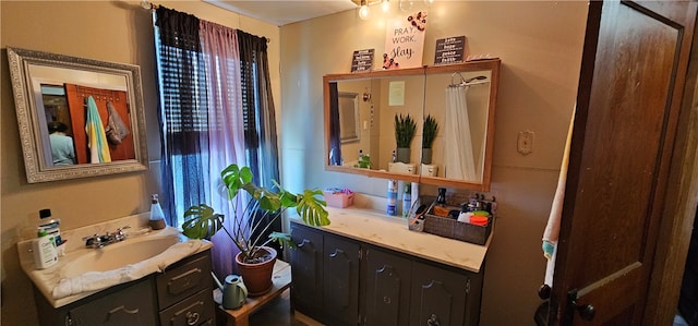 bathroom with vanity with extensive cabinet space