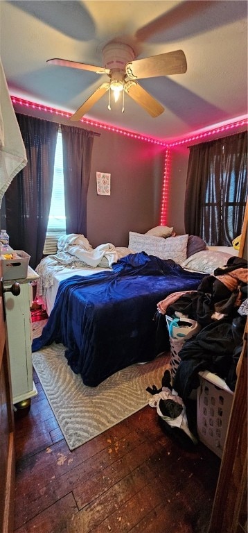 bedroom featuring dark wood-type flooring and ceiling fan