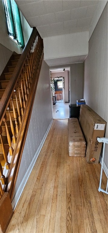 stairs featuring wood-type flooring