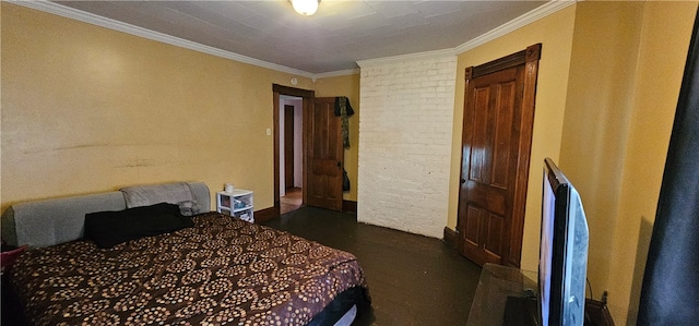 bedroom featuring ornamental molding and ornate columns