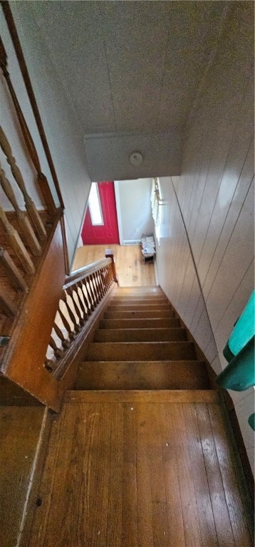 stairway featuring hardwood / wood-style floors