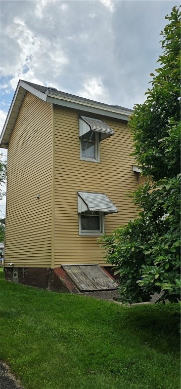 view of home's exterior featuring a lawn