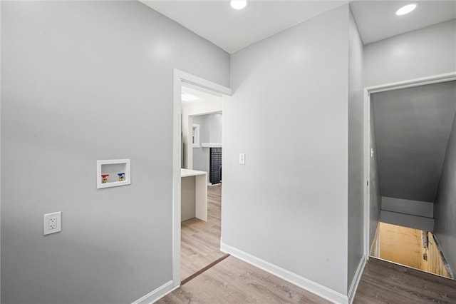 hall with light hardwood / wood-style floors