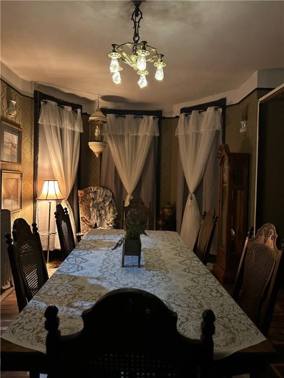 dining space featuring an inviting chandelier