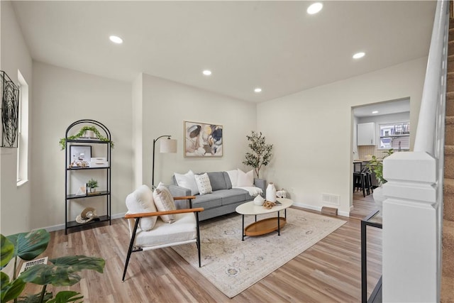 living room with light hardwood / wood-style floors