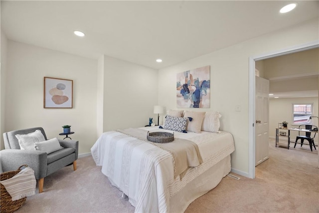 bedroom featuring light colored carpet