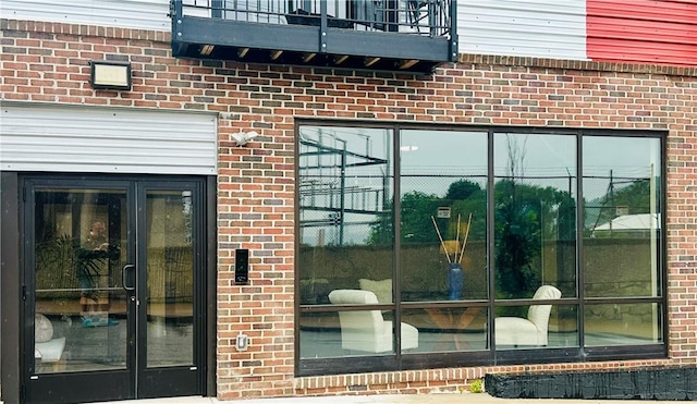 property entrance with a balcony