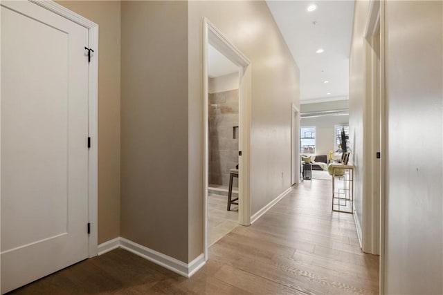 hall with light hardwood / wood-style floors