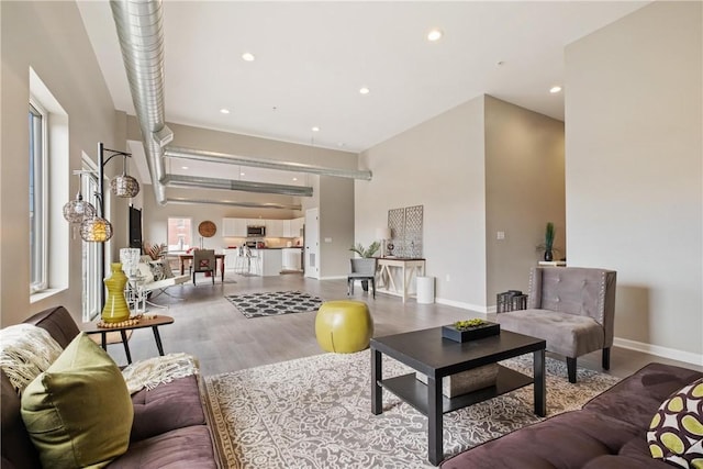 living room with plenty of natural light and light wood-type flooring