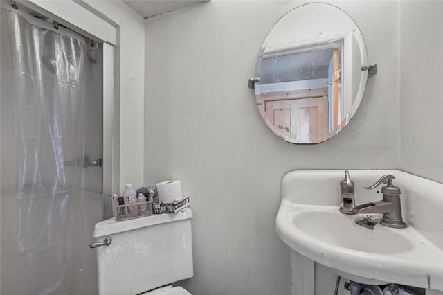 bathroom featuring sink and toilet