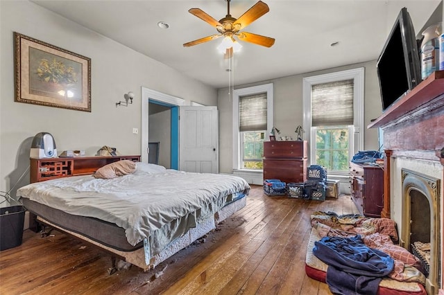 bedroom featuring ceiling fan and wood-type flooring