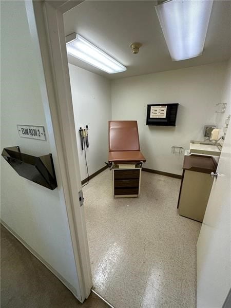 interior space featuring baseboards and tile patterned floors