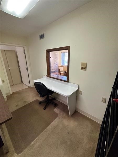 office area with carpet floors, visible vents, and baseboards