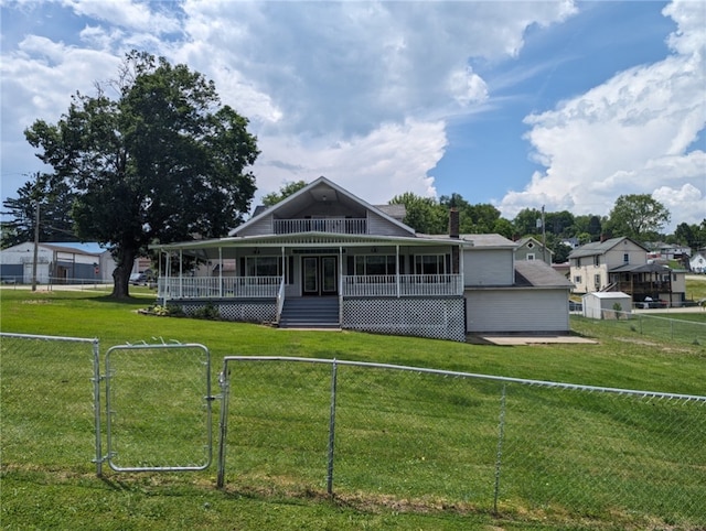 farmhouse with a front yard and a porch