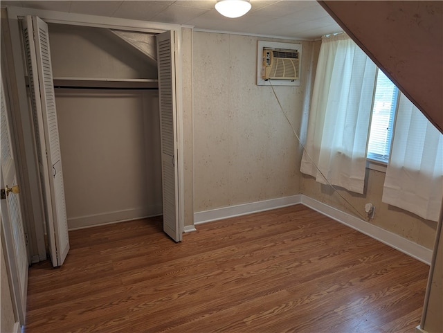 interior space with a closet and hardwood / wood-style flooring