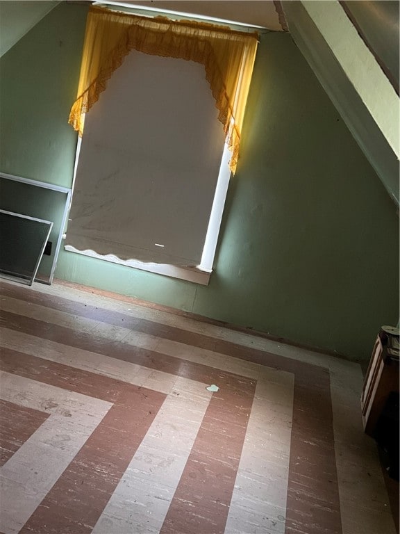 bonus room with hardwood / wood-style floors