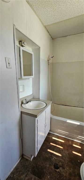 bathroom featuring vanity and shower / tub combination