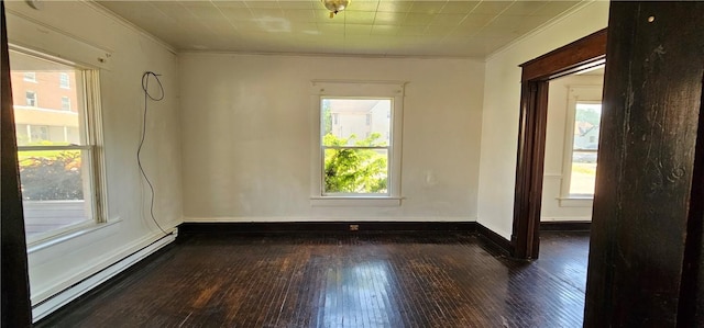 empty room with dark hardwood / wood-style flooring, a baseboard radiator, and ornamental molding