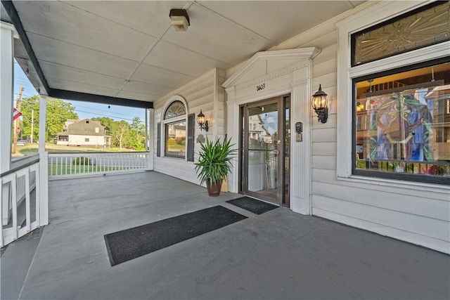 property entrance with covered porch