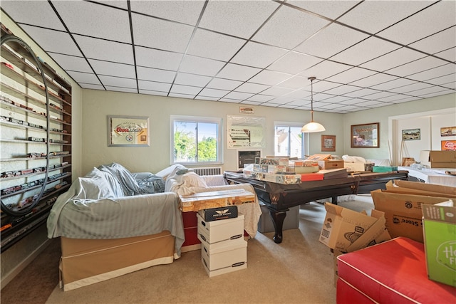 interior space with a drop ceiling and carpet