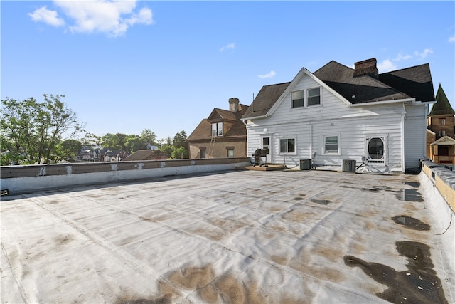 rear view of house featuring a patio and central air condition unit