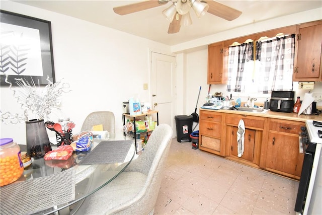 kitchen featuring white range and sink