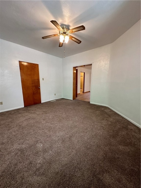 empty room featuring carpet and ceiling fan