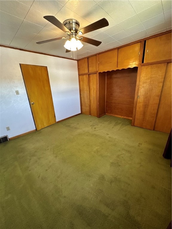 unfurnished bedroom featuring a closet, ceiling fan, and light colored carpet