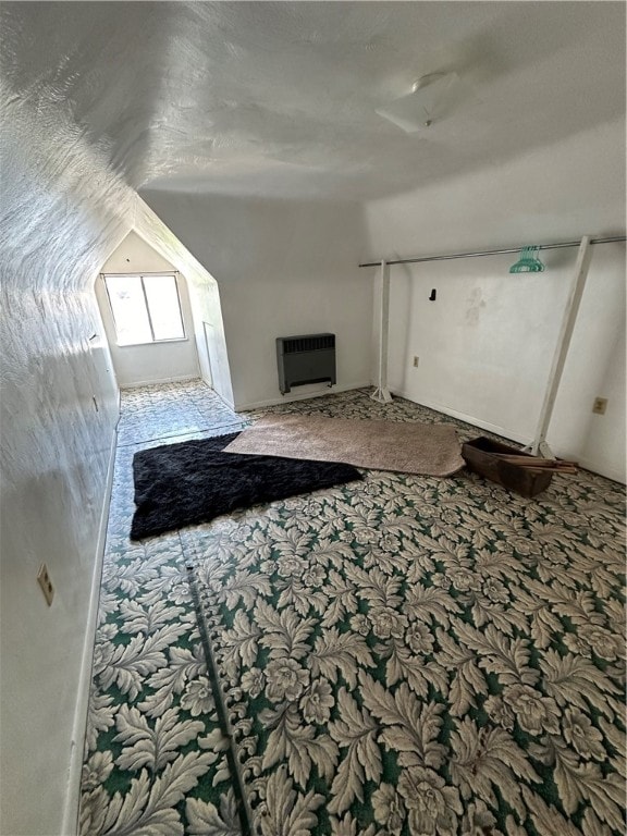 unfurnished living room featuring lofted ceiling