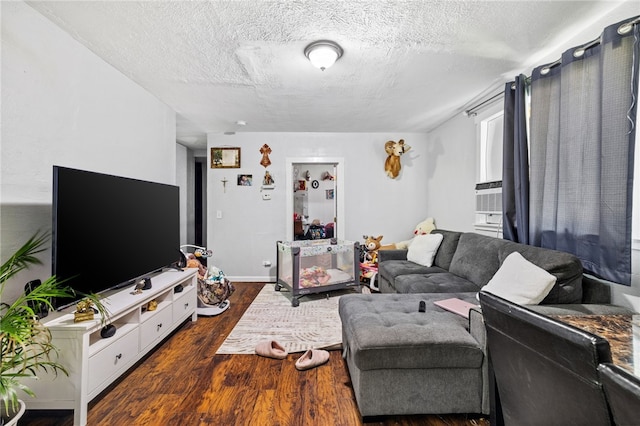 living room featuring a textured ceiling and dark hardwood / wood-style floors